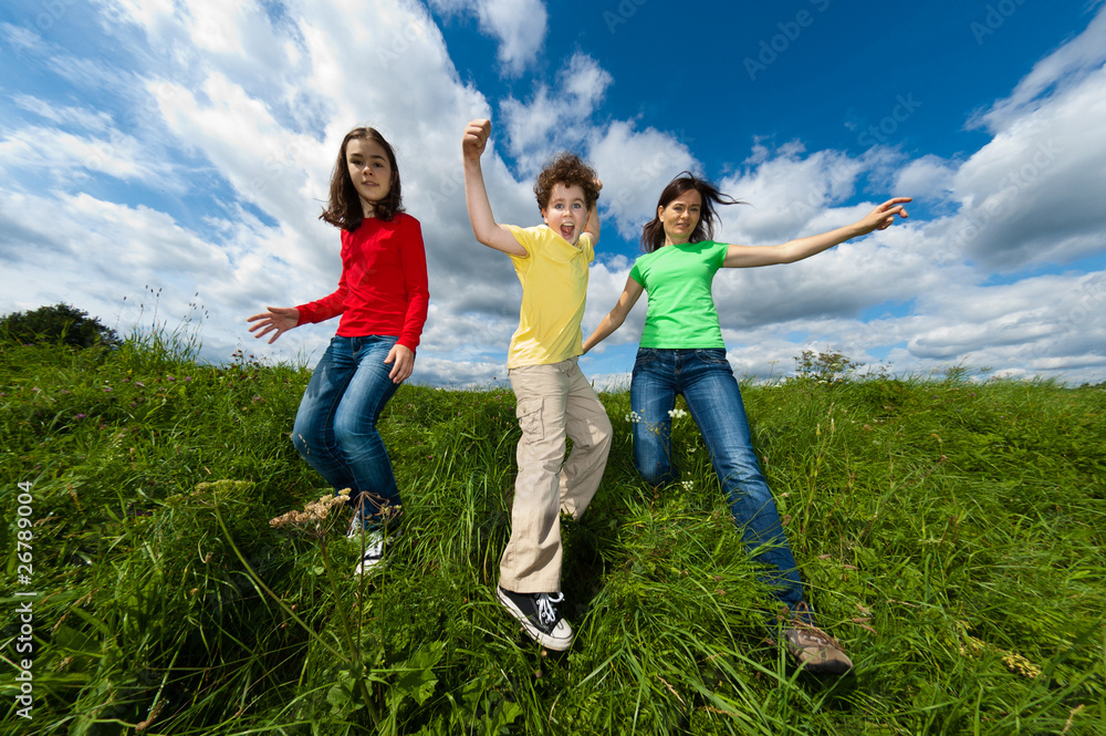 Active family - mother and kids running outdoor Active family - mother and kids running outdoor