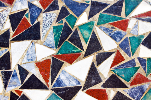 Triangular colorful mosaic texture on wall