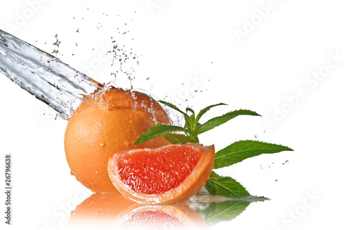 Water splash on grapefruit with mint isolated on white