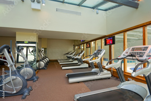 row of jogging simulators in gym
