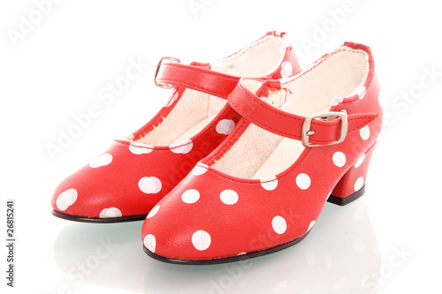a pair of red dotted spanish shoes