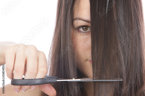 Young Woman Cutting Hair. Model Released