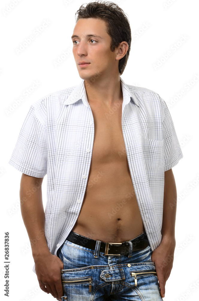 sexy young man in blue jeans, standing with hands in pocket sexy young man in blue jeans, standing with hands in pocket
