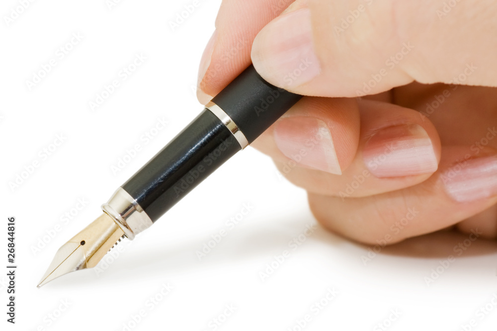 Fountain pen in hand isolated on white background Fountain pen in hand isolated on white background