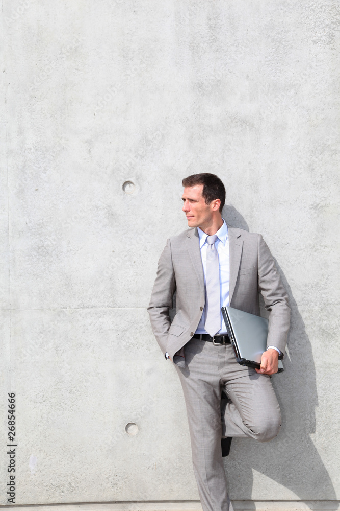 Businessman with grey suit waiting outdoors Businessman with grey suit waiting outdoors