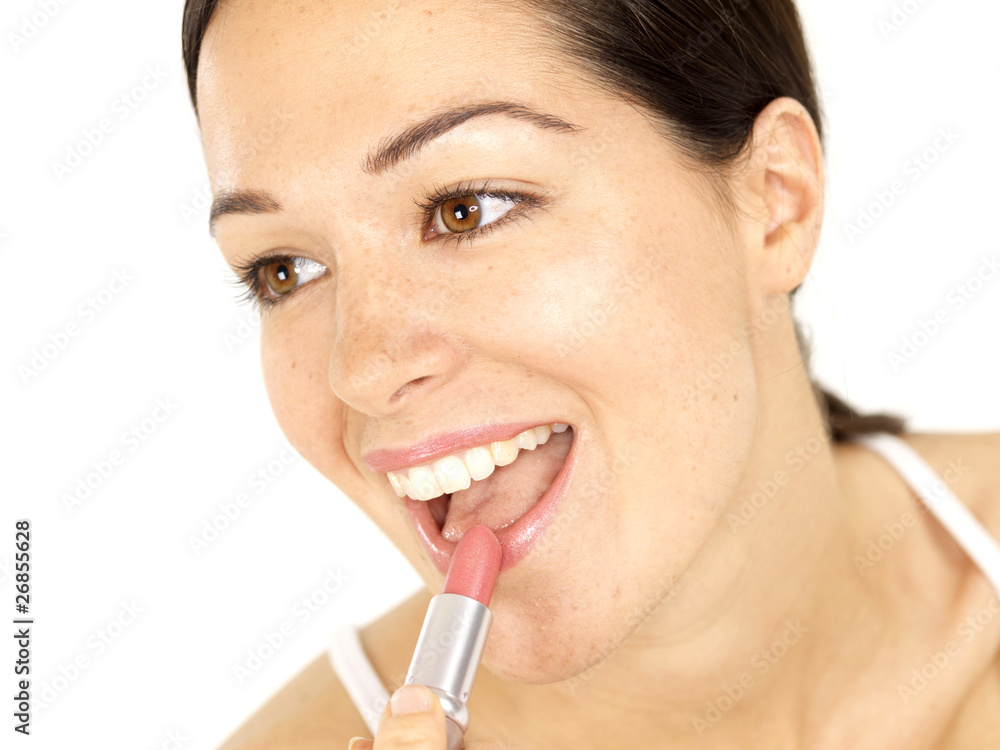 Young Woman Applying Lipstick. Model Released Young Woman Applying Lipstick. Model Released