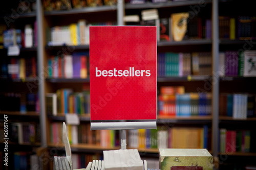 Bestsellers area in bookstore - many books in the background. photo