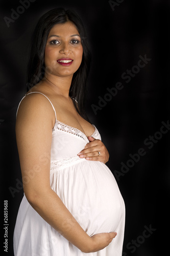 sexy beautiful pregnant Indian woman in white dress Stock 写真 | Adobe Stock