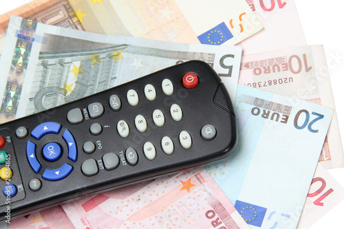 TV remote control on the euro banknotes