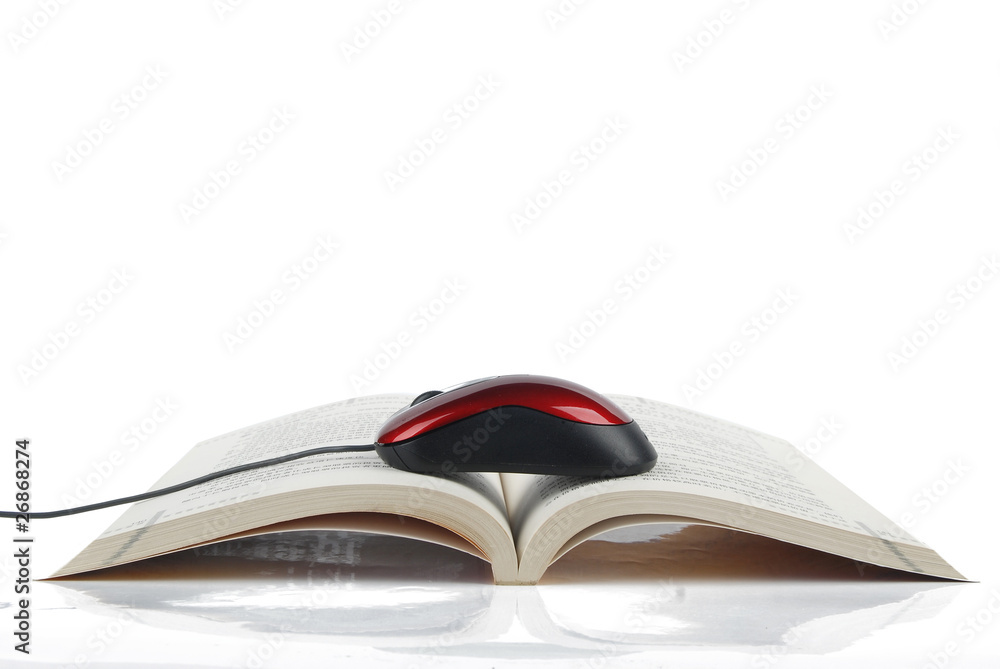 Book and mouse on white background