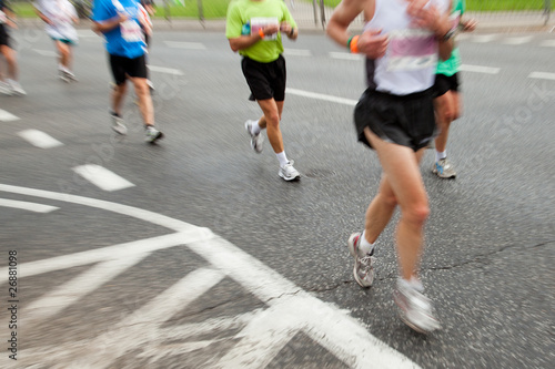 People running in marathon in intentional motion blur