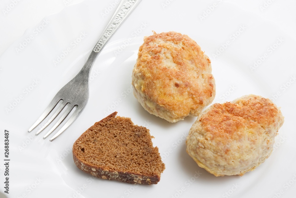 Fresh meatloaf (chop) in plate with bread and fork. Fresh meatloaf (chop) in plate with bread and fork.
