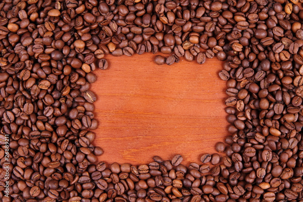 Coffee beans on wooden background with space for text Coffee beans on wooden background with space for text
