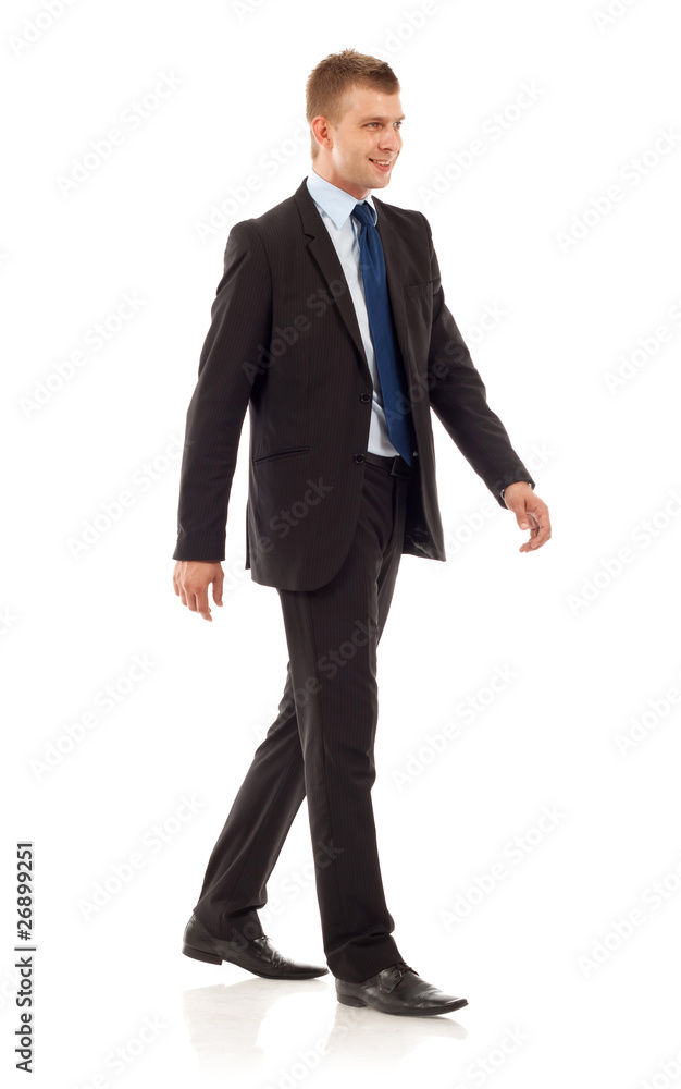 young businessman is walking young businessman is walking