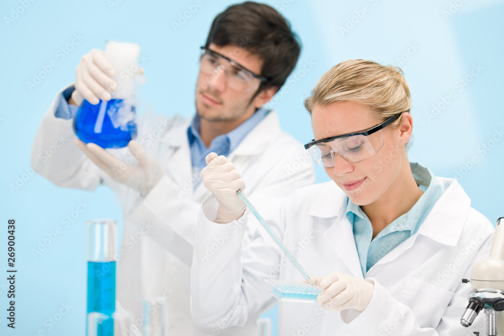 Flu virus experiment - scientist in laboratory Flu virus experiment - scientist in laboratory