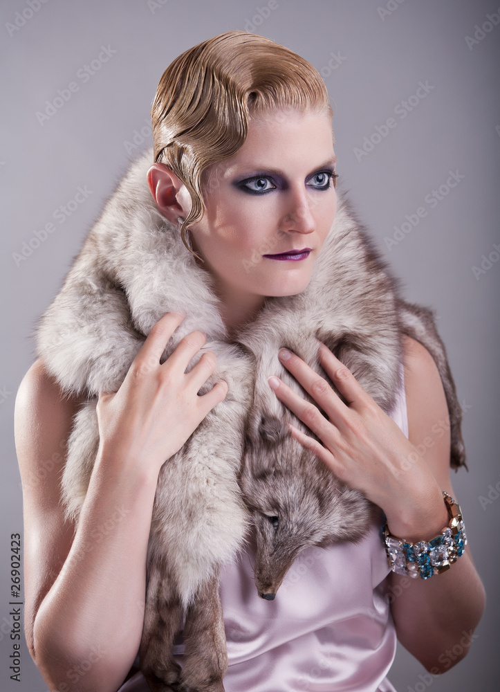 Lady posing with a fox fur in studio Lady posing with a fox fur in studio