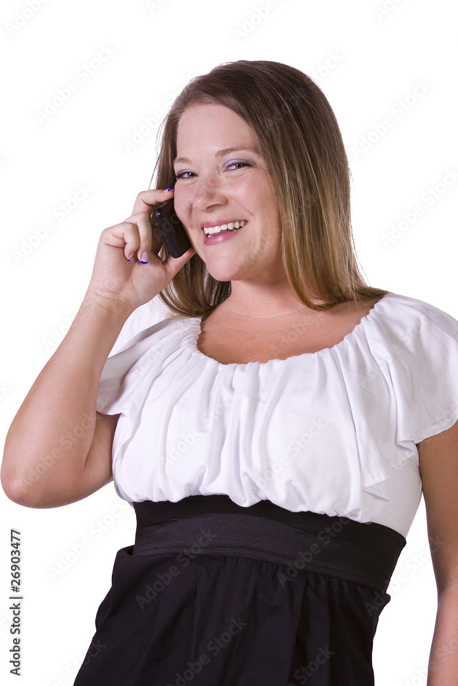 Cheerful young woman smiling while chatting on phone Cheerful young woman smiling while chatting on phone