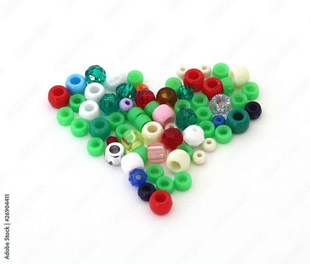 heart shape made of craft beads, isolated over white heart shape made of craft beads, isolated over white