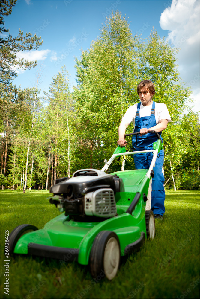 lawn mover man working on the backyard lawn mover man working on the backyard