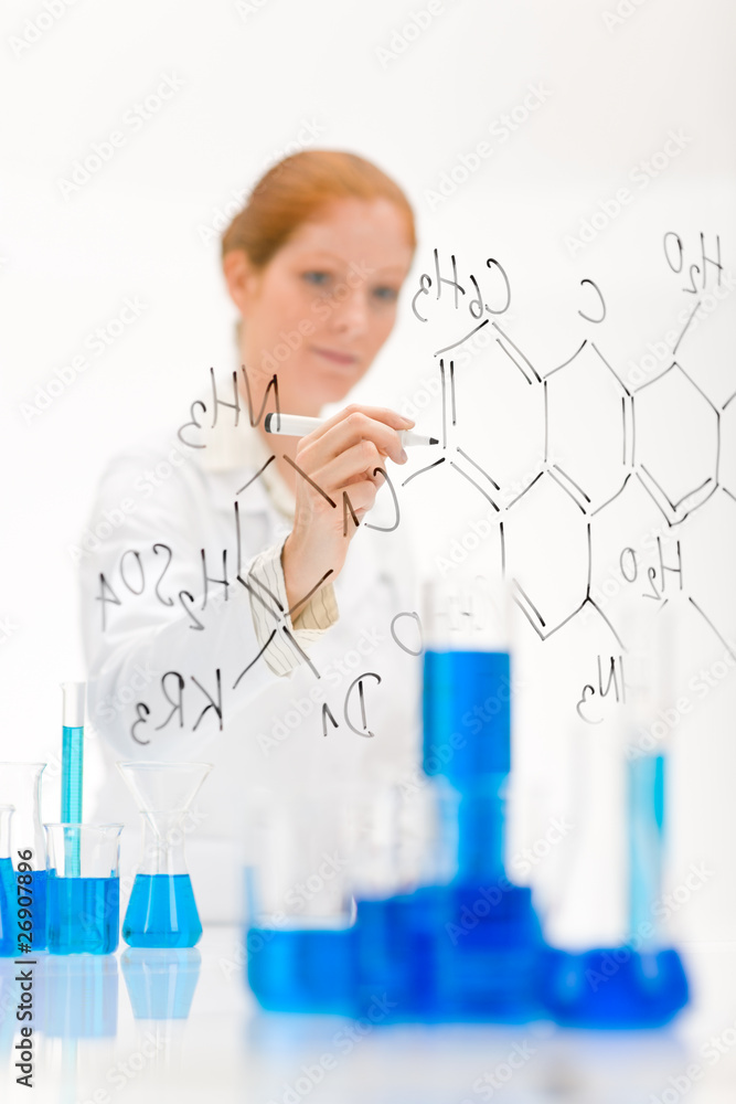Woman scientist in laboratory write chemical formula Woman scientist in laboratory write chemical formula