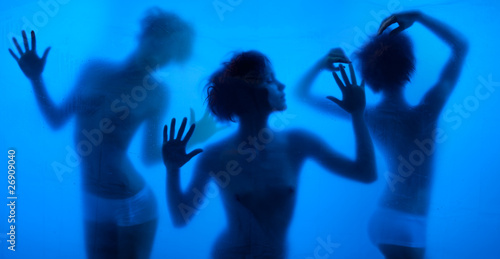 Moving and dancing silhouettes of women
