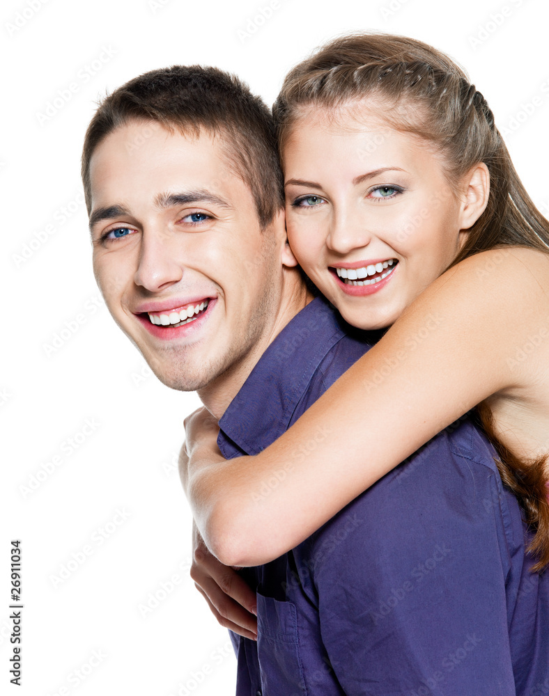 Beautiful young happy couple - on white background Beautiful young happy couple - on white background