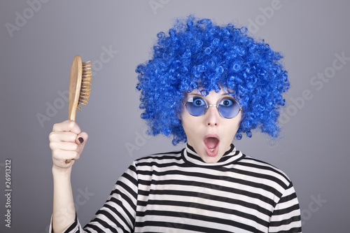 Slika na platnu Surprised blue hair girl with comb.