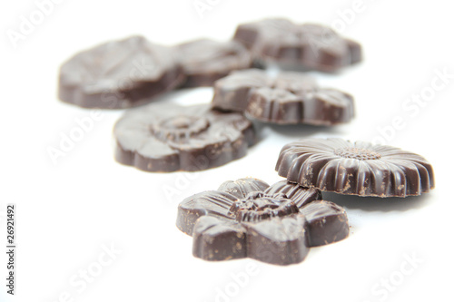 Chocolates in the shape of flowers isolated on white