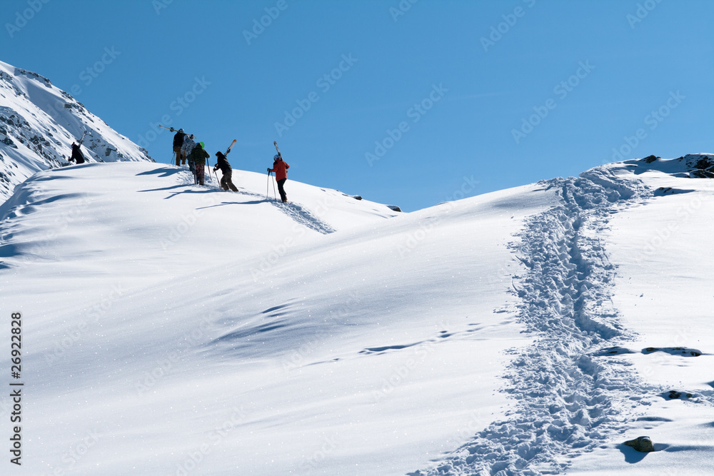 Skiers ascending on a mountain
