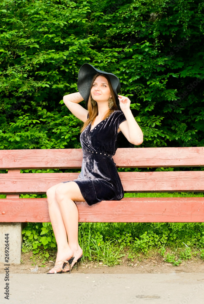 Naklejka premium young woman on the bench