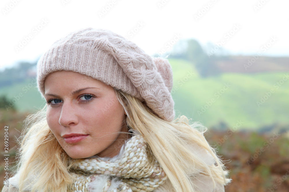 Blond woman wearing wool cap in autumn Blond woman wearing wool cap in autumn