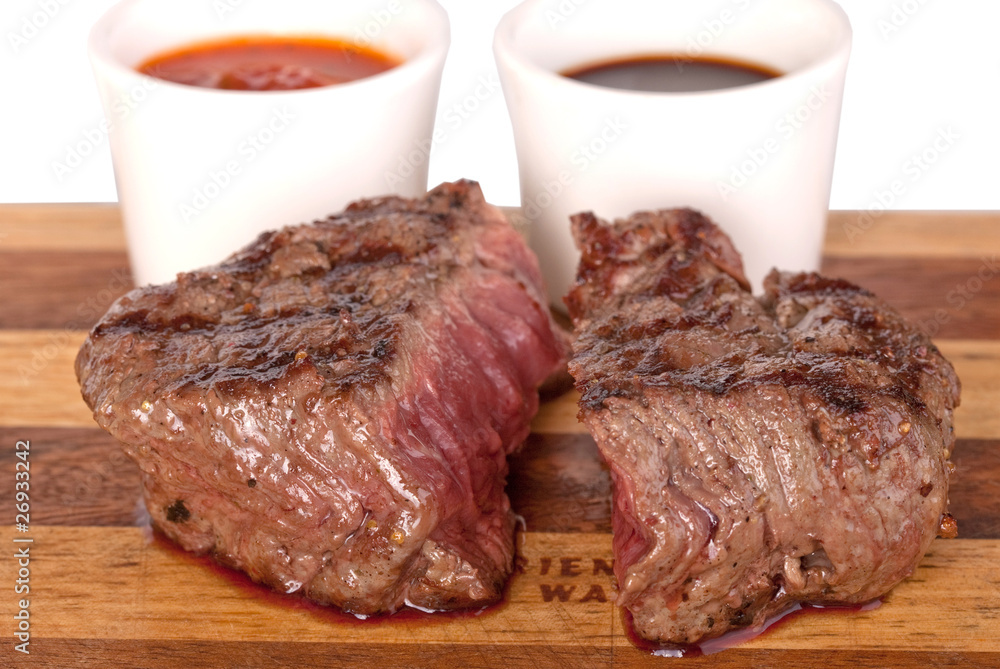 roasted meat on a cutting board. isolated on a white background roasted meat on a cutting board. isolated on a white background