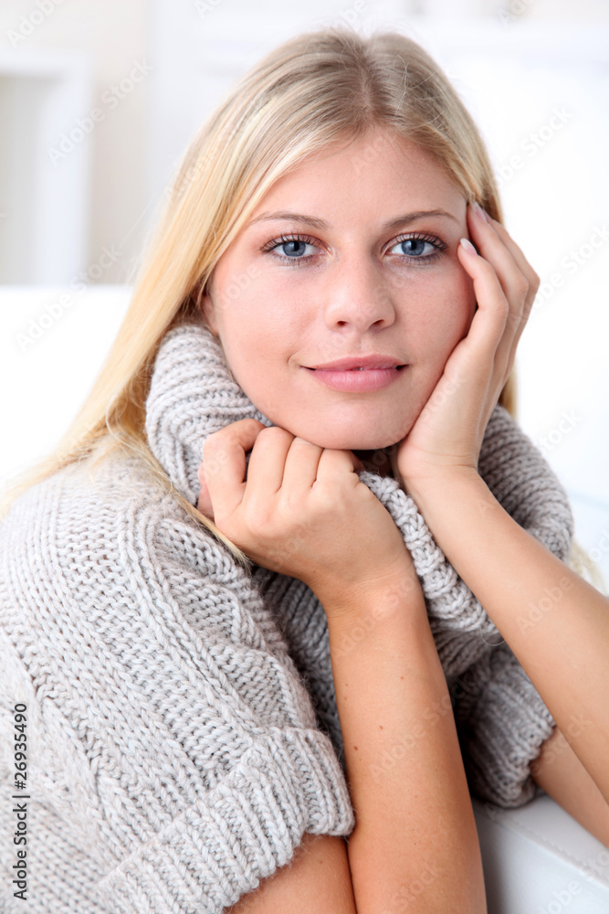 Beautiful blond woman realxing at home in winter Beautiful blond woman realxing at home in winter