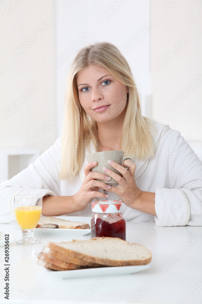 Closeup of beautiful woman having breakfast