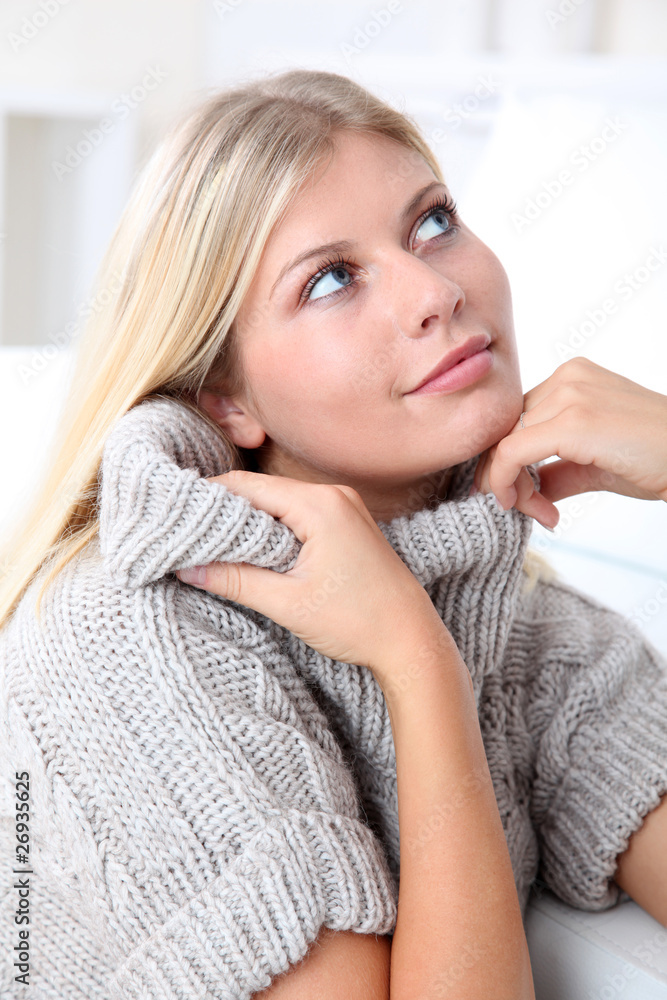 Beautiful blond woman realxing at home in winter Beautiful blond woman realxing at home in winter
