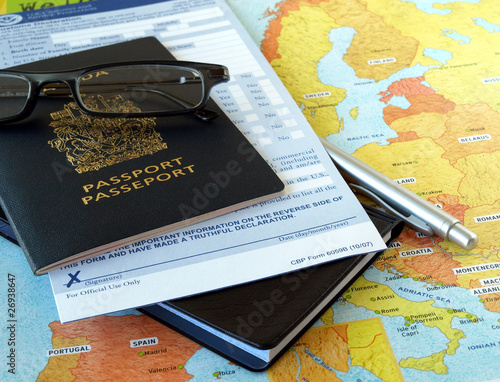 Canada passport with business travel necessities on the map