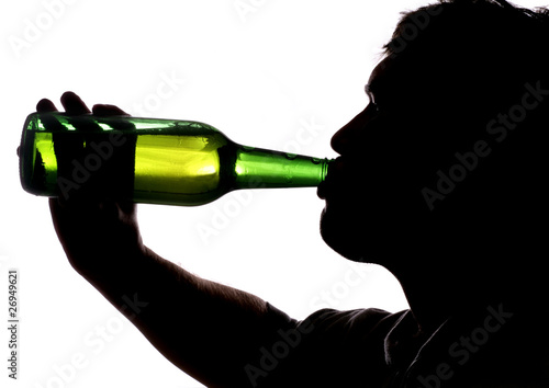 Man drinking bottle of beer