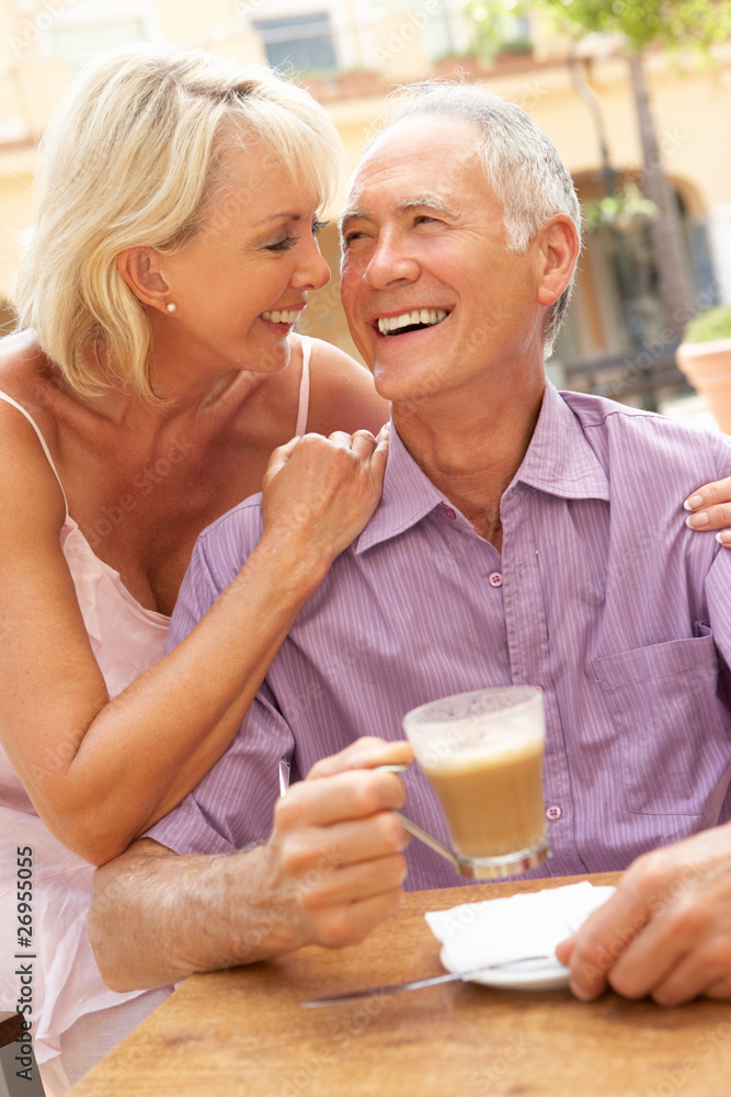 Senior Couple Enjoying Coffee And Cake In Cafe Senior Couple Enjoying Coffee And Cake In Cafe