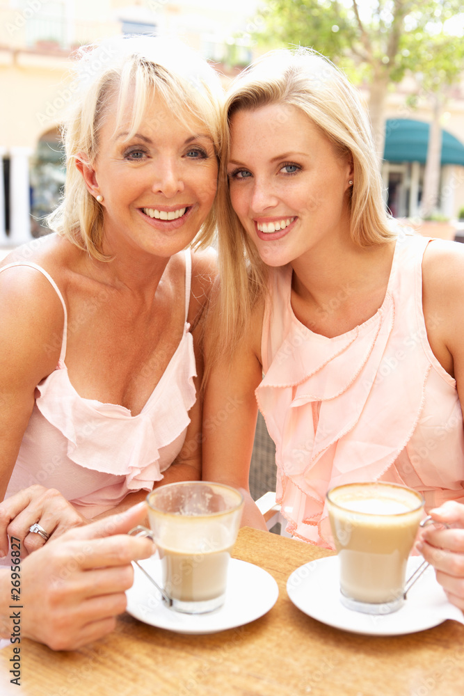 Two Women Enjoying Cup Of Coffee In Cafe Two Women Enjoying Cup Of Coffee In Cafe