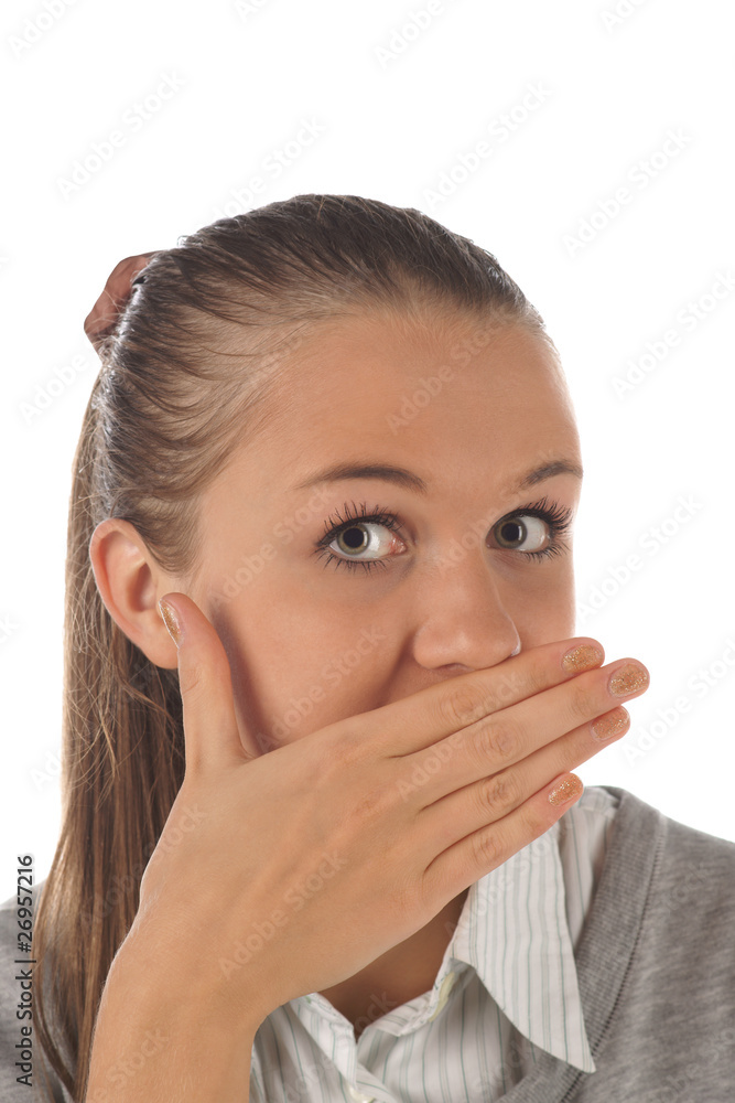 Young girl with hand on mouth (isolated) Young girl with hand on mouth (isolated)