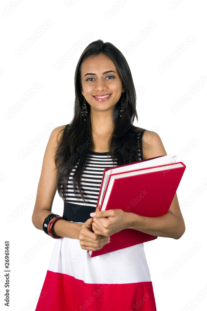Young teenage girl holding books. Young teenage girl holding books.