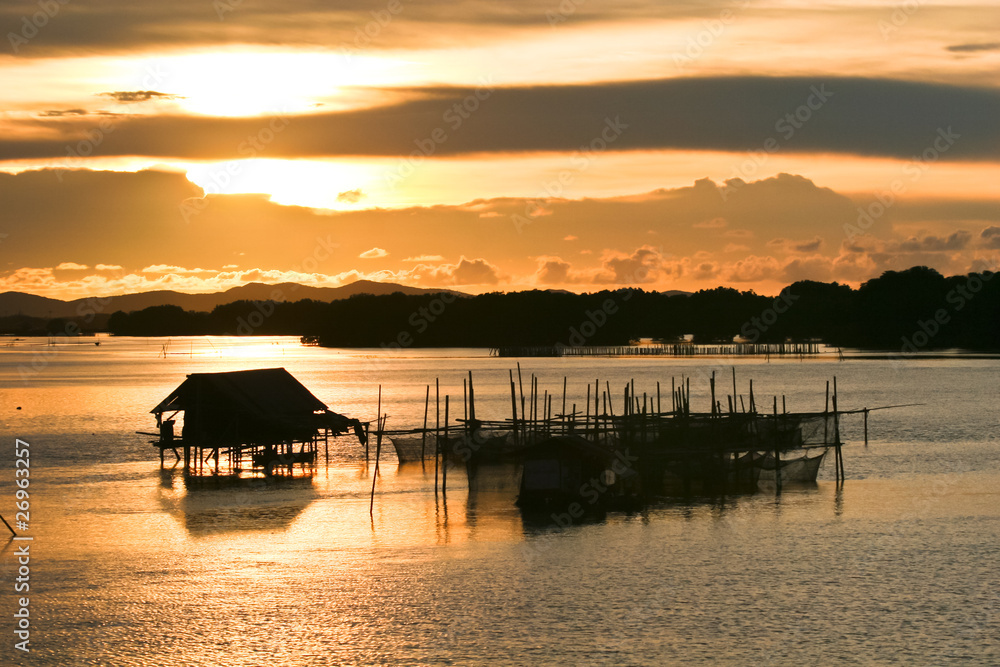 Fisherman lifestyle on sunset at Thailand