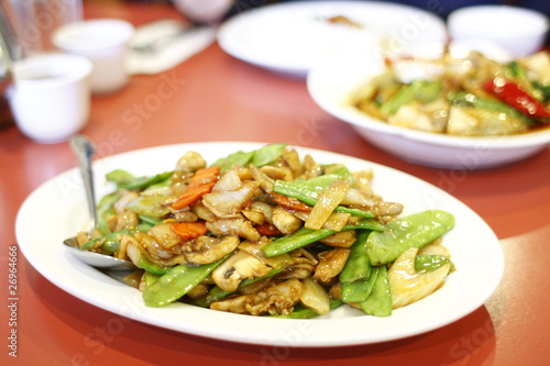 Chinese entree of chicken with snow peas