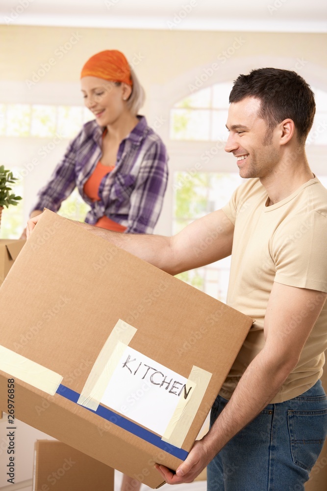 Smiling couple with boxes Smiling couple with boxes