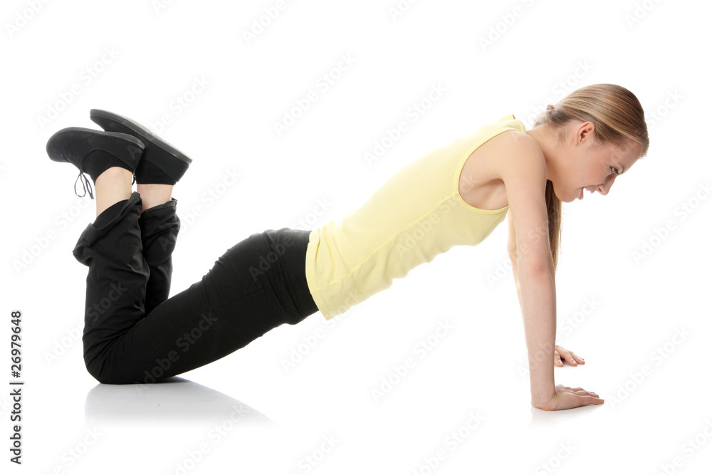 Obraz premium Young woman doing exercise