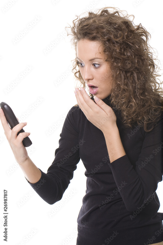 girl looking at phone and looking surprised girl looking at phone and looking surprised
