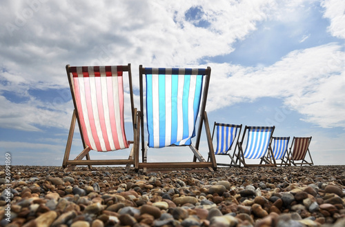 Deck chairs on Brighton beach, UK photo