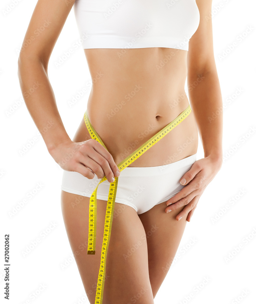Woman measuring her slim body isolated on white