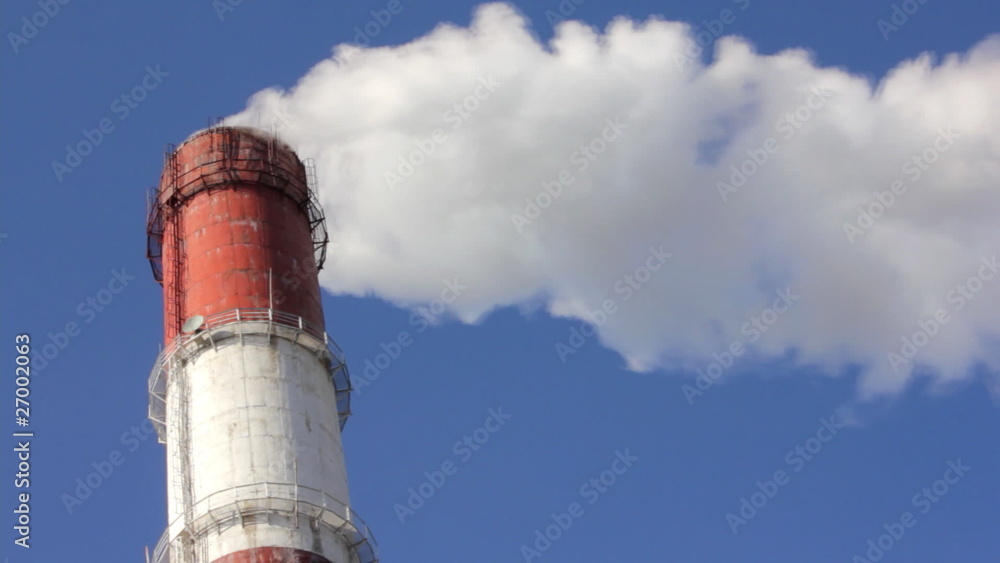 factory chimney with smoke under blue sky - timelapse factory chimney with smoke under blue sky - timelapse