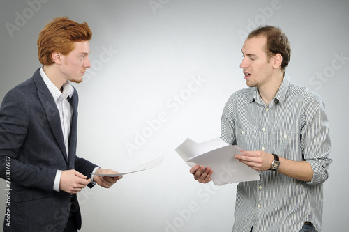 nervous manager explaining documents to his chief